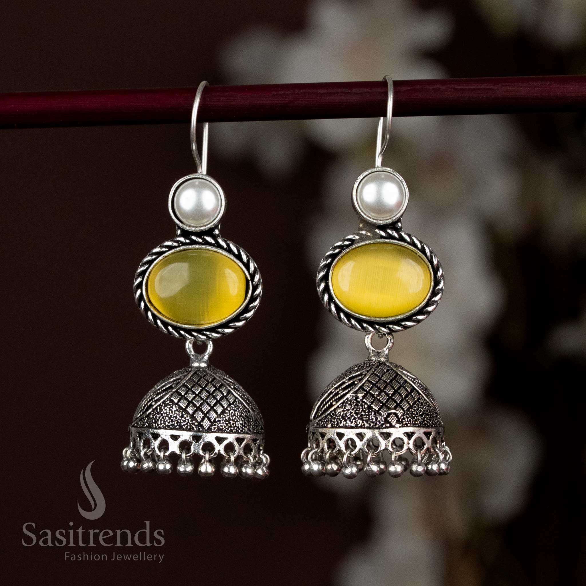 Elegant Oxidised Silver Jhumka Earrings Featuring Light Yellow Oval Stone And Delicate Pearl Hangings, Designed To Add A Soft Glow To Ethnic And Casual Looks – Sasitrends