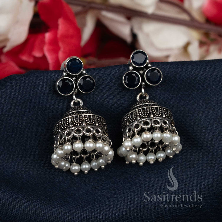 Elegant oxidised dark blue pearl bead cluster Jhumka earrings adorned with shimmering stone-studded tops – a luxurious traditional jewellery choice for graceful women – Sasitrends

