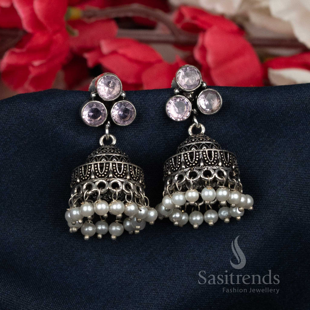 Heavenly oxidised white Jhumka earrings featuring clustered pearls and dazzling stone-studded tops – premium handcrafted traditional jewellery ideal for bridal wear and celebrations – Sasitrends