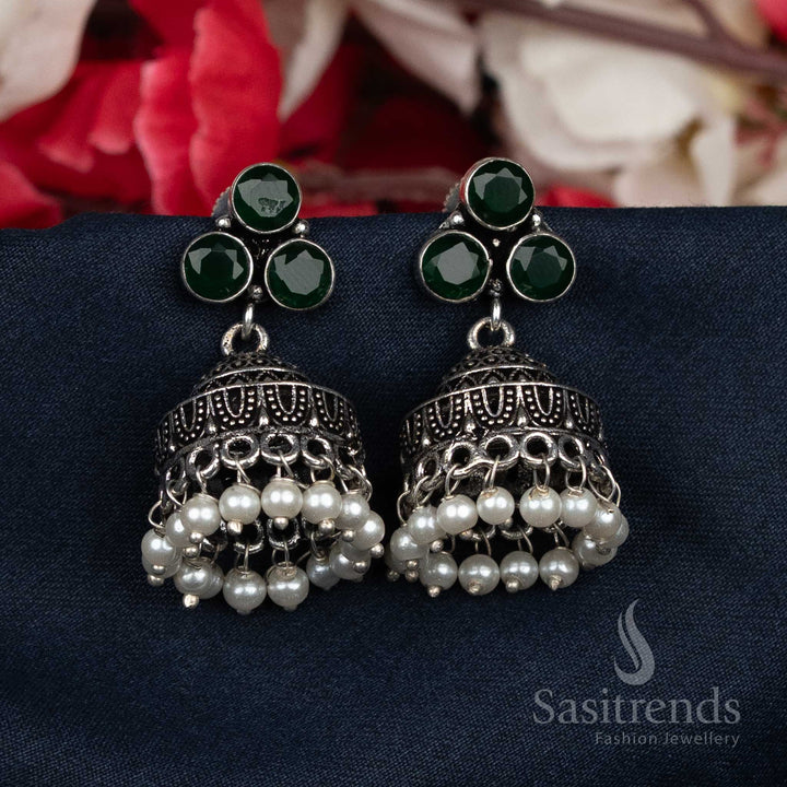 Majestic oxidised green Jhumka earrings crafted with pearl bead clusters and glittering studs – traditional luxury wear for grand celebrations and weddings – Sasitrends