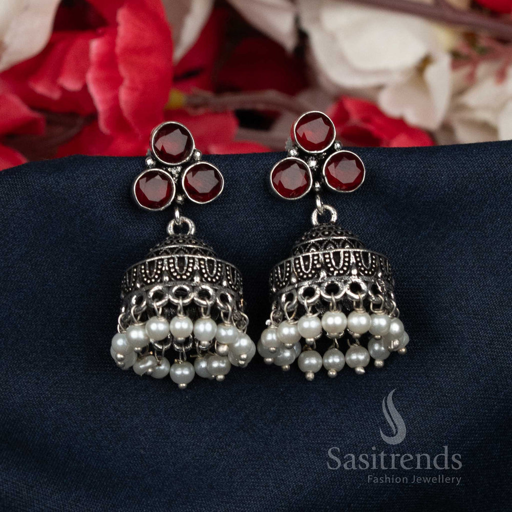 Opulent oxidised ruby Jhumka earrings with rich pearl bead clustering and radiant sparkling studs – designer traditional jewellery for elegant festive wear – Sasitrends