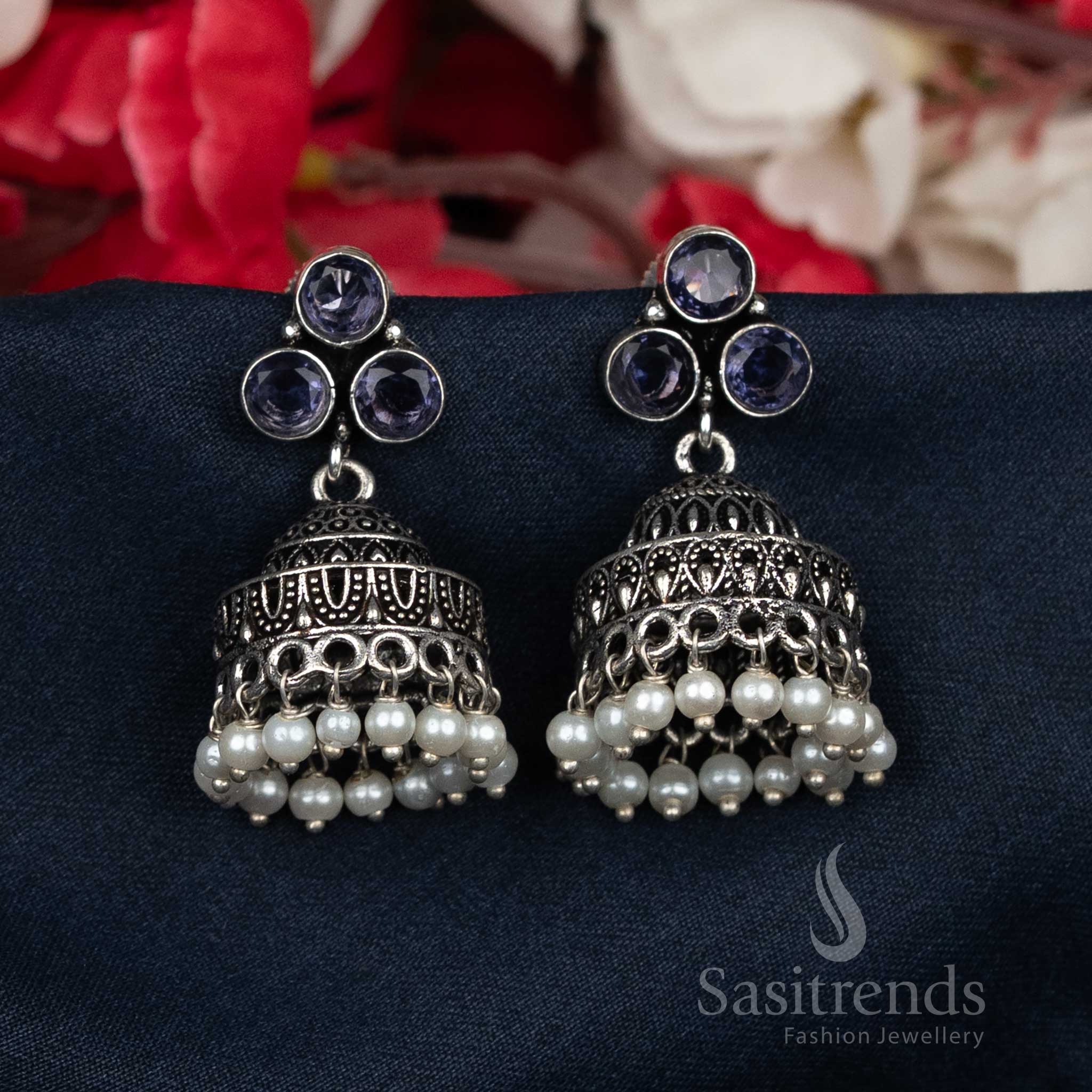 Lavish oxidised purple pearl cluster Jhumka earrings featuring dazzling stone-studded tops – a festive traditional women’s jewellery statement piece radiating royal elegance – Sasitrends