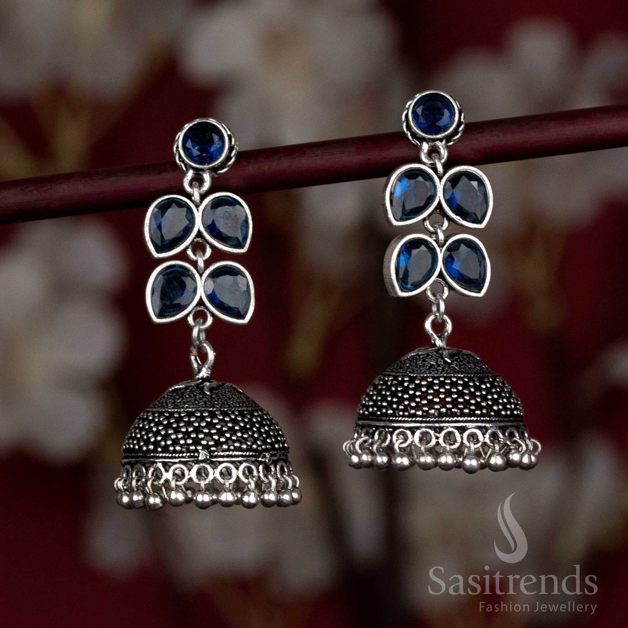 Dynamic oxidised dome earrings with rich blue stones and crown-like floral tops – suited for Navaratri street celebrations and festive cultural walks – Sasitrends