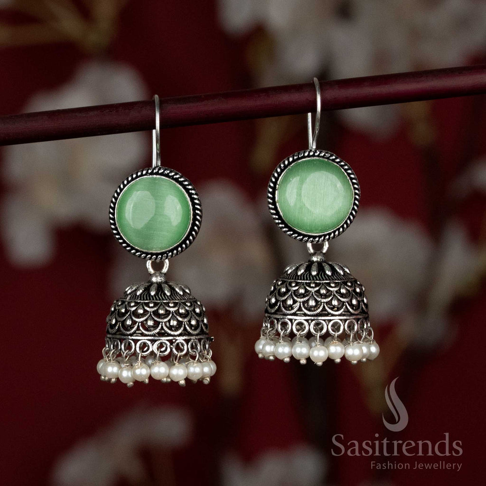 Radiant green oxidised jhumka earrings featuring natural stone stud and pearl drop – ideal for Navaratri pandal visits and flared lehenga styles – Sasitrends