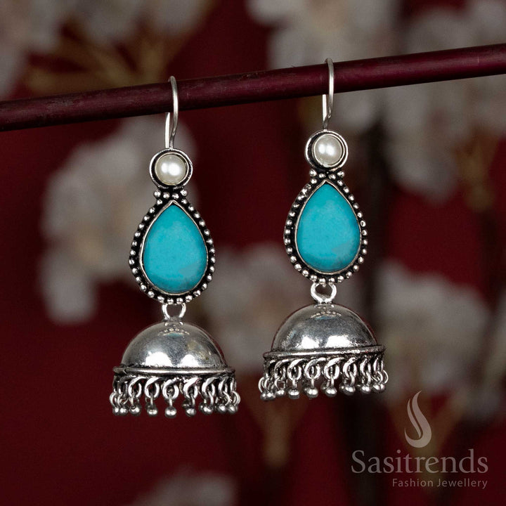 Breezy oxidised dome jhumkas with sky-blue teardrop natural stone – perfect for light Navaratri morning wear and pastel dupatta styling – Sasitrends