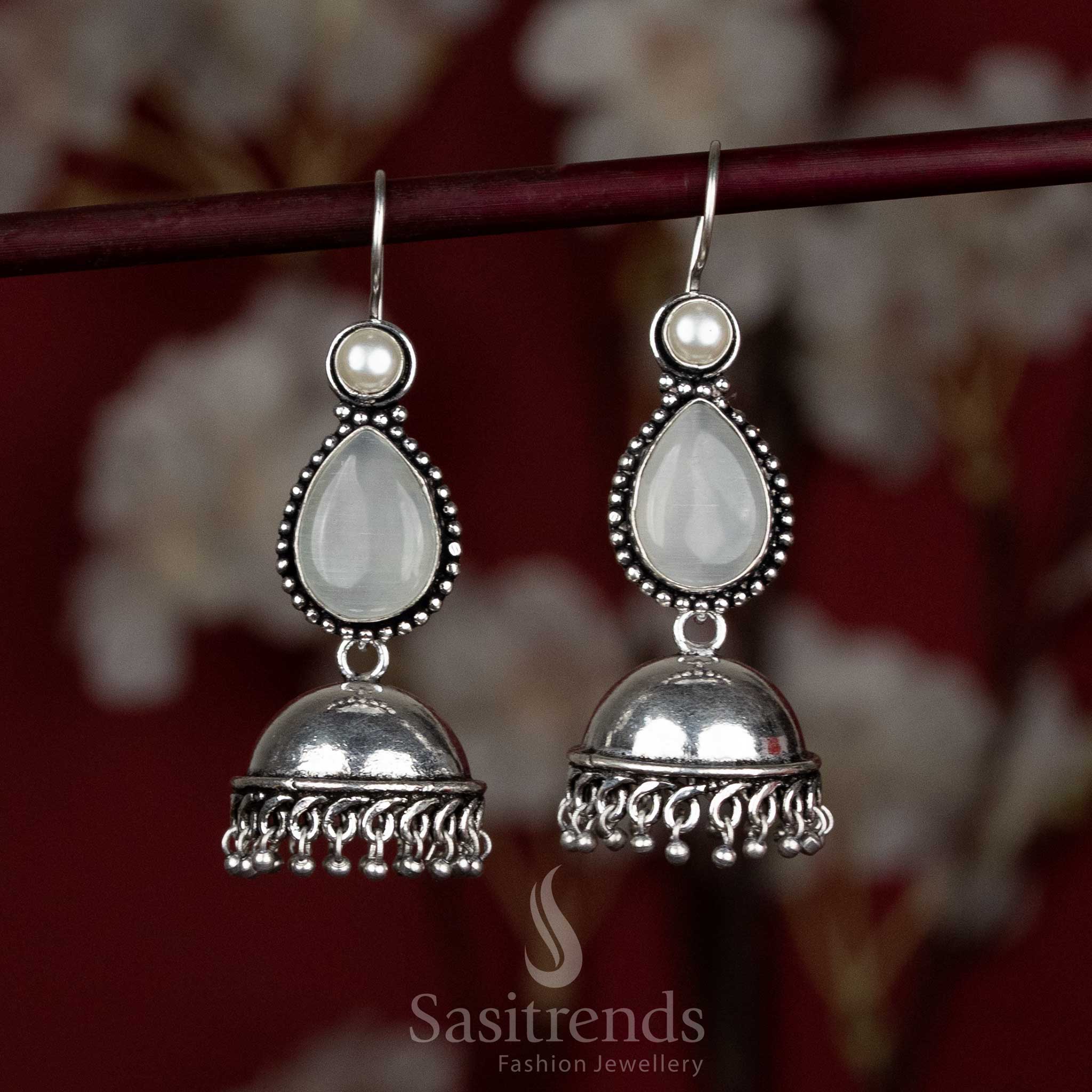 Pure white dome jhumkas with oxidised texture and elegant stone drop – perfect for Navaratri temple walks and serene moments – Sasitrends