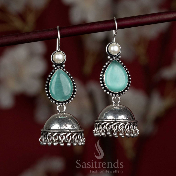 Soft mint oxidised jhumkas with dome and hanging stone – subtle yet eye-catching for Navaratri family gatherings – Sasitrends