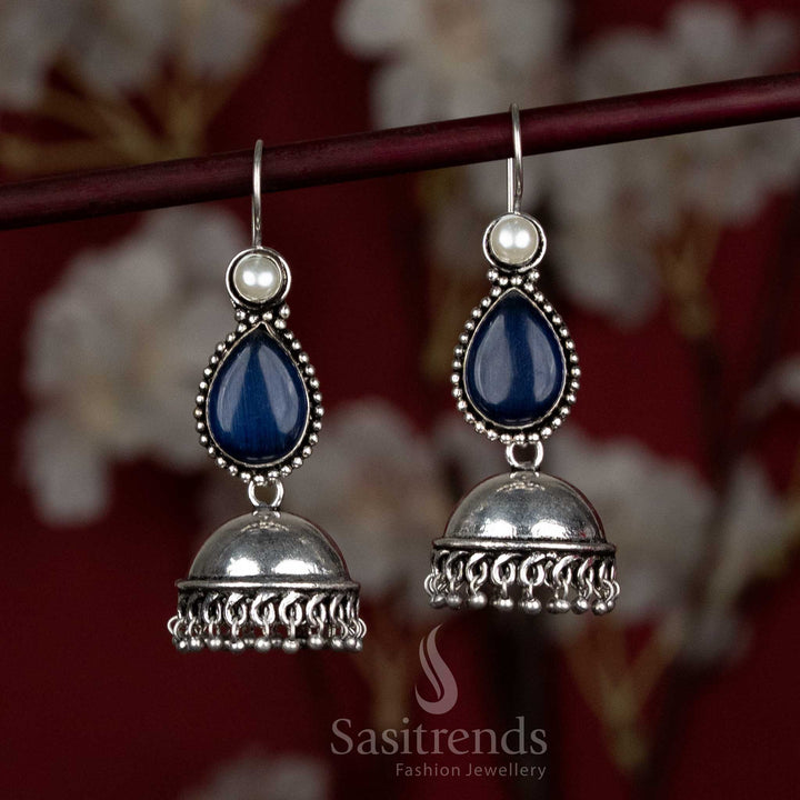Striking oxidised blue jhumka earrings with dome structure and hanging natural stone – made for Navaratri dance floors and stage energy – Sasitrends