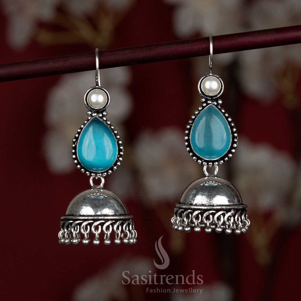 Deep ocean-blue oxidised earrings with elegant dome and dangling stone – designed for Navaratri evenings and bold blouse combos – Sasitrends