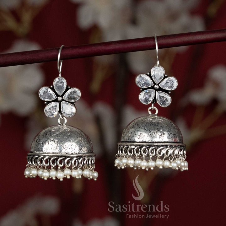 Elegant white oxidised jhumka earrings with floral stone design and pearl beads – ideal for serene Navaratri puja mornings and calm daytime wear – Sasitrends