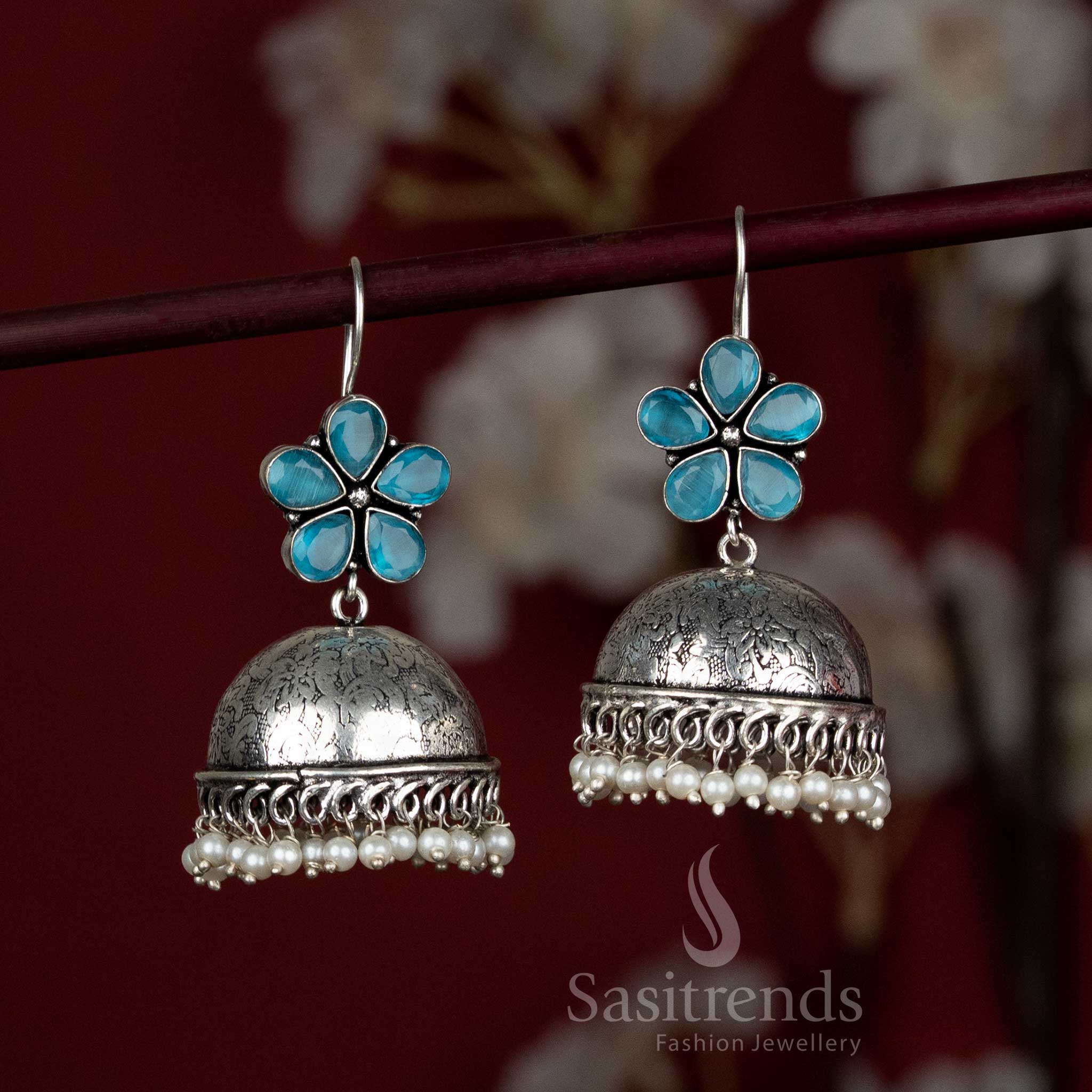 Soothing sky-blue oxidised jhumka earrings with floral stone top and pearl bead border – ideal for graceful Navaratri mornings and simple festive wear – Sasitrends