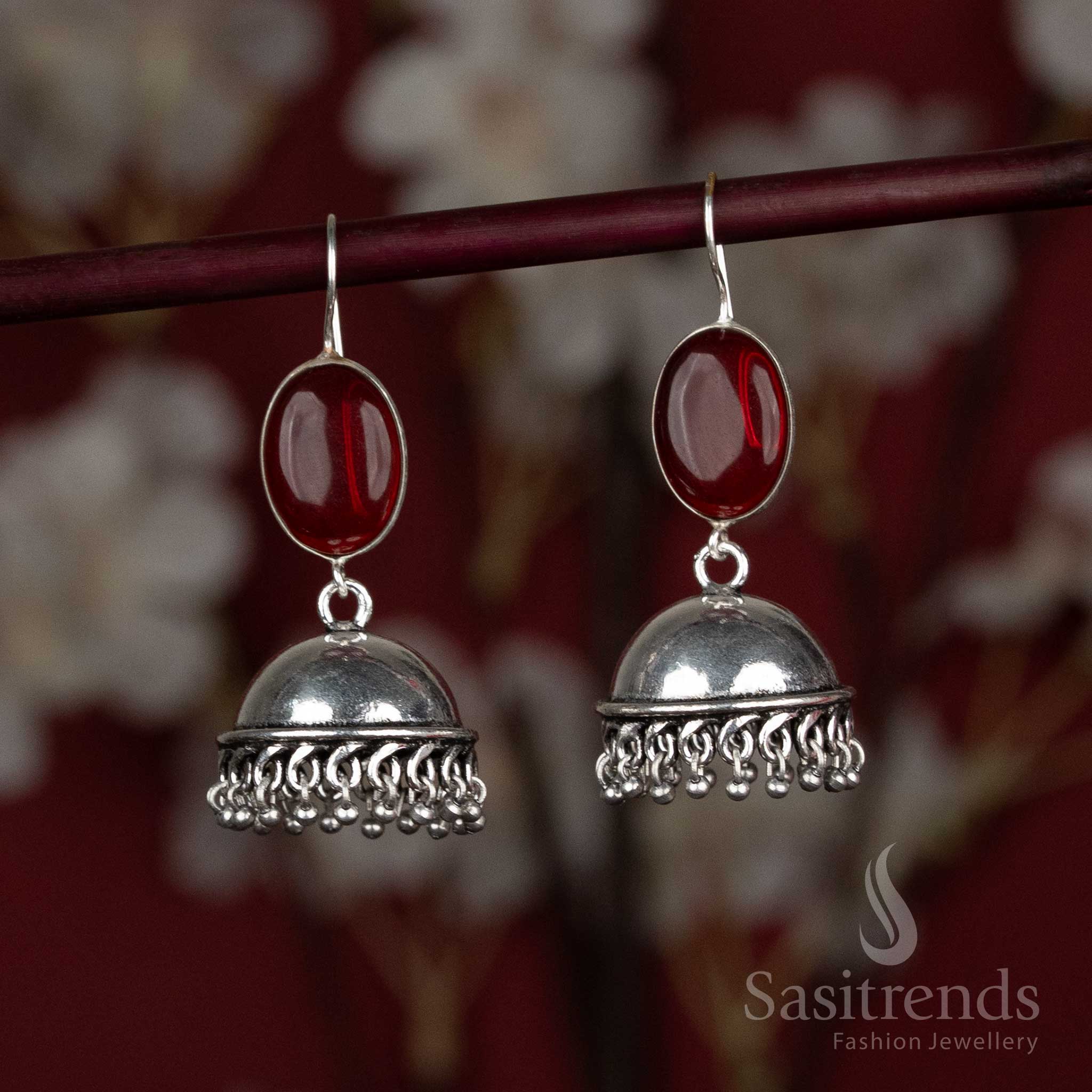 Fiery red oxidised jhumka earrings with oval centre stone and tiny hanging silver beads – a charming pair for festive kurtis and vibrant gatherings – Sasitrends