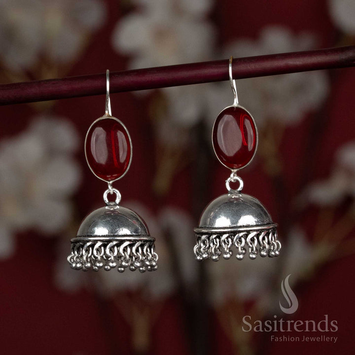 Fiery red oxidised jhumka earrings with oval centre stone and tiny hanging silver beads – a charming pair for festive kurtis and vibrant gatherings – Sasitrends