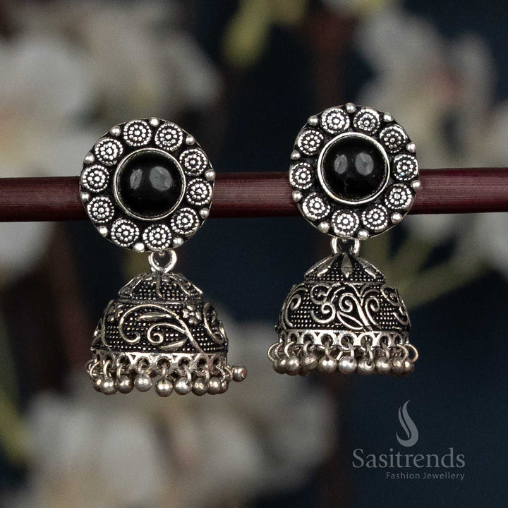 Black Oxidised jhumka earrings with floral design and stone stud - Sasitrends