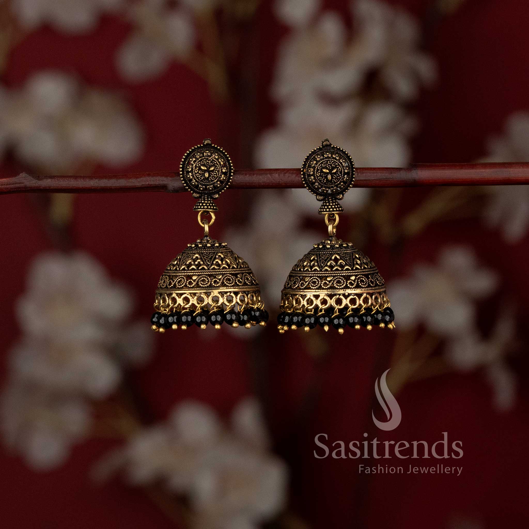 Heritage glory Niranjana traditional matte gold plated temple style jhumka earrings featuring intricate floral motifs and graceful drop embellishments – ideal festive wear jewellery with timeless ethnic beauty – Sasitrends