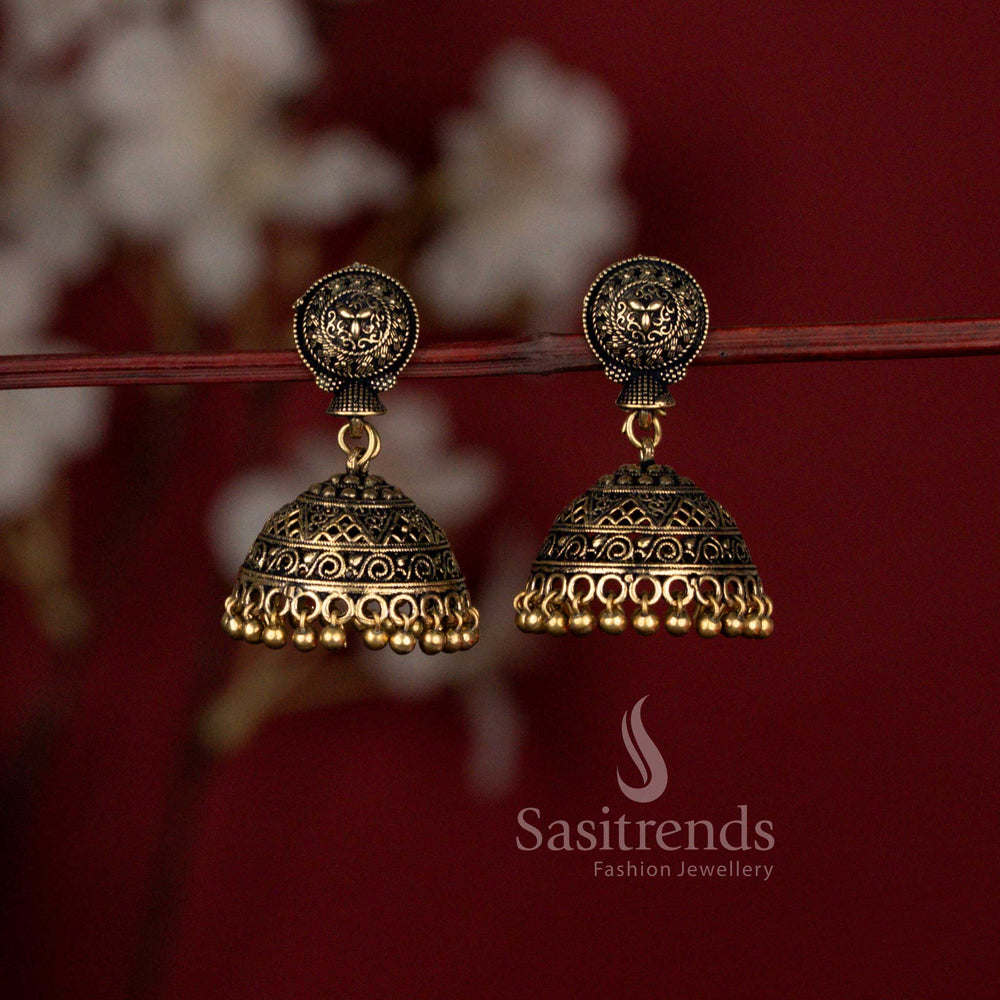 Heritage glory Niranjana traditional matte gold plated temple style jhumka earrings featuring intricate floral motifs and graceful drop embellishments – ideal festive wear jewellery with timeless ethnic beauty – Sasitrends