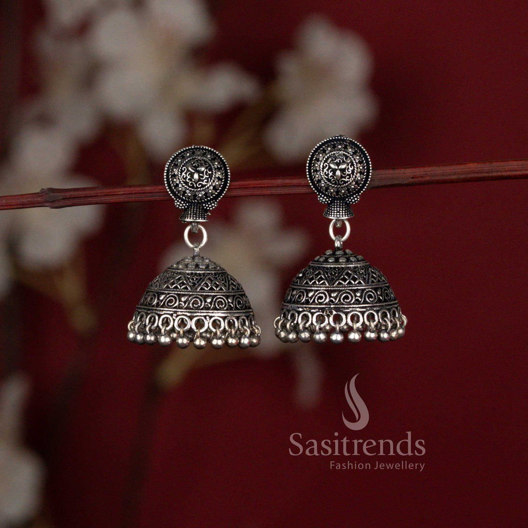 Heritage glory Niranjana traditional matte gold plated temple style jhumka earrings featuring intricate floral motifs and graceful drop embellishments – ideal festive wear jewellery with timeless ethnic beauty – Sasitrends