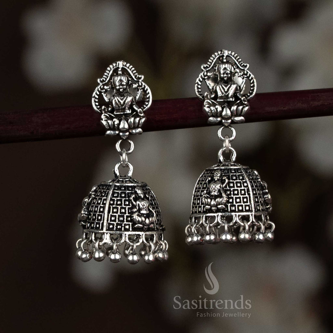 Temple design jhumka earrings in antique finish