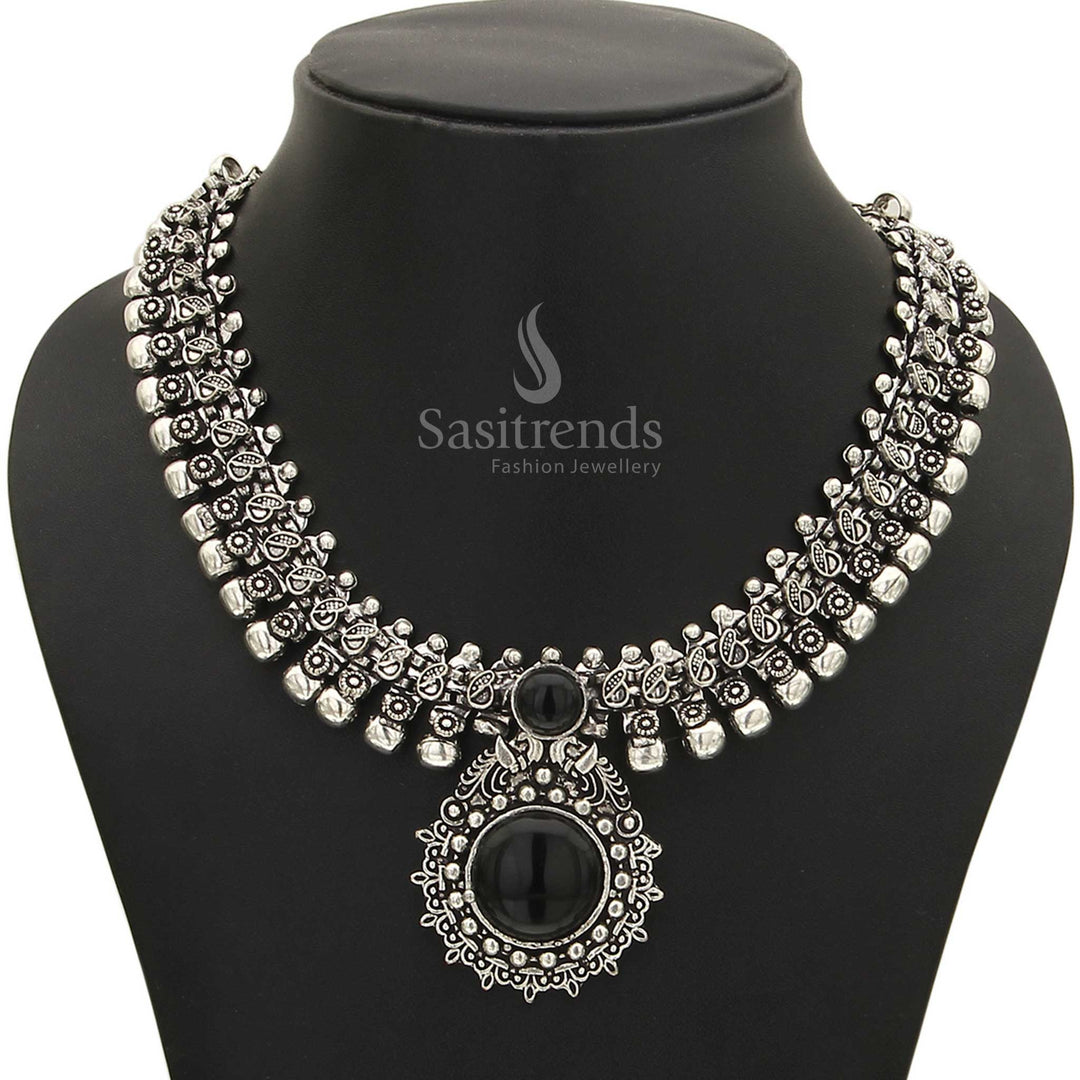 Captivating Haarini oxidised silver necklace with a polished midnight onyx black gemstone pendant, adding a touch of timeless allure and edgy style from Sasitrends