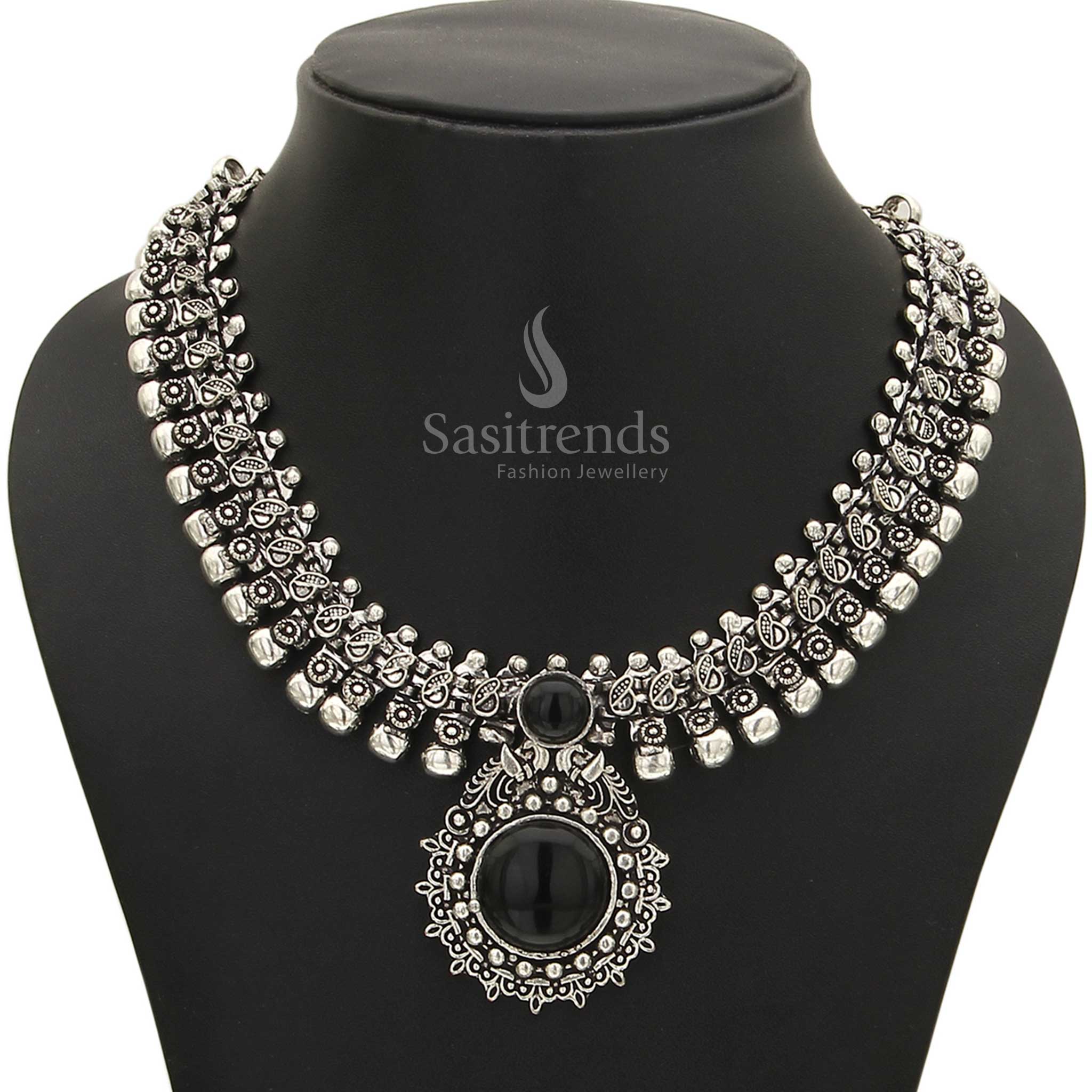 Captivating Haarini oxidised silver necklace with a polished midnight onyx black gemstone pendant, adding a touch of timeless allure and edgy style from Sasitrends
