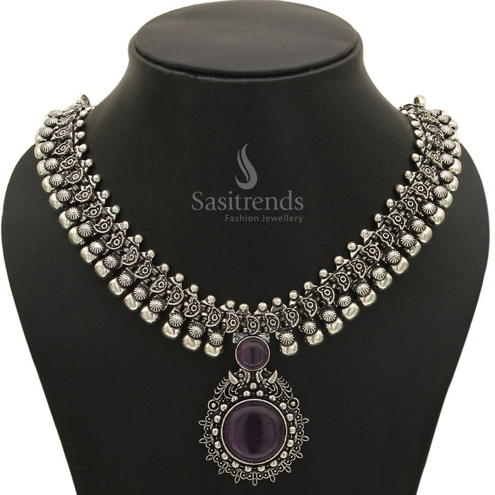 Enchanting Haarini oxidised silver necklace adorned with a delicate plum blossom violet gemstone pendant, offering a subtle yet captivating charm from Sasitrends