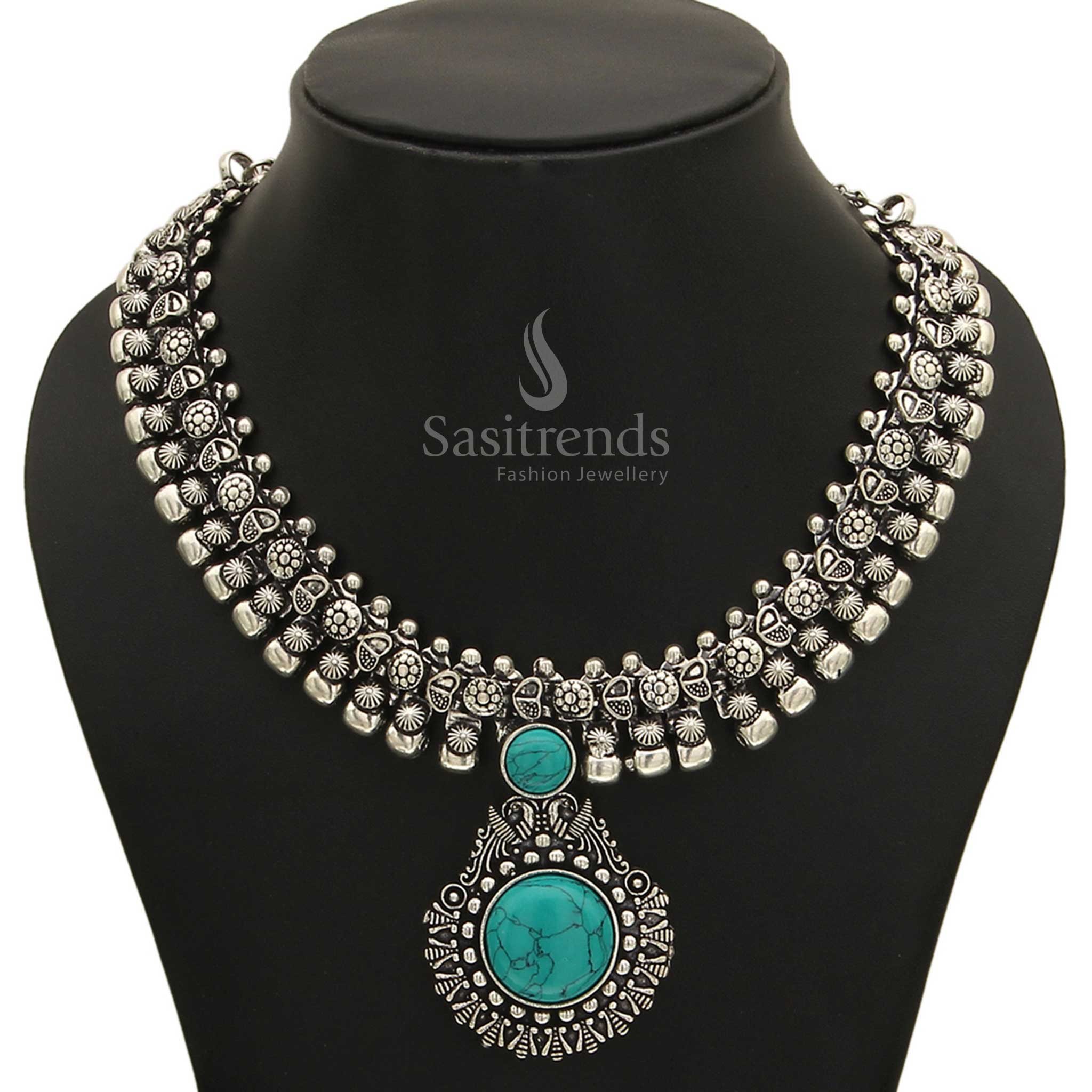 Unique Haarini oxidised silver necklace showcasing a distinctive desert sky turquoise gemstone pendant, evoking a sense of exotic allure and natural beauty from Sasitrends