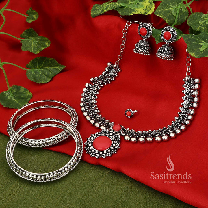 Vermilion Magic Haarini oxidised red jewellery set showcasing a peacock cutwork necklace and finely detailed mango motif bangles, ideal for traditional celebrations and weddings – Sasitrends