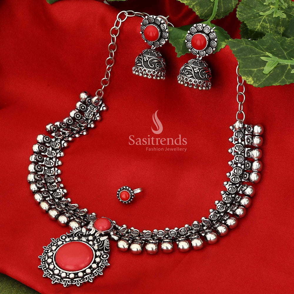 Ruby Royalty Haarini oxidised silver stones jewellery set in vibrant red with classic kemp work highlights and regal floral stud earrings designed for luxurious traditional wear – Sasitrends