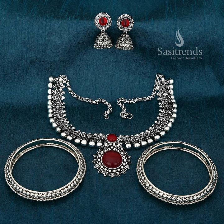 Graceful Legacy Haarini oxidised silver maroon jewellery set adorned with mango leaf motif bangles and an ethnic goddess-inspired necklace for rich traditional elegance – Sasitrends