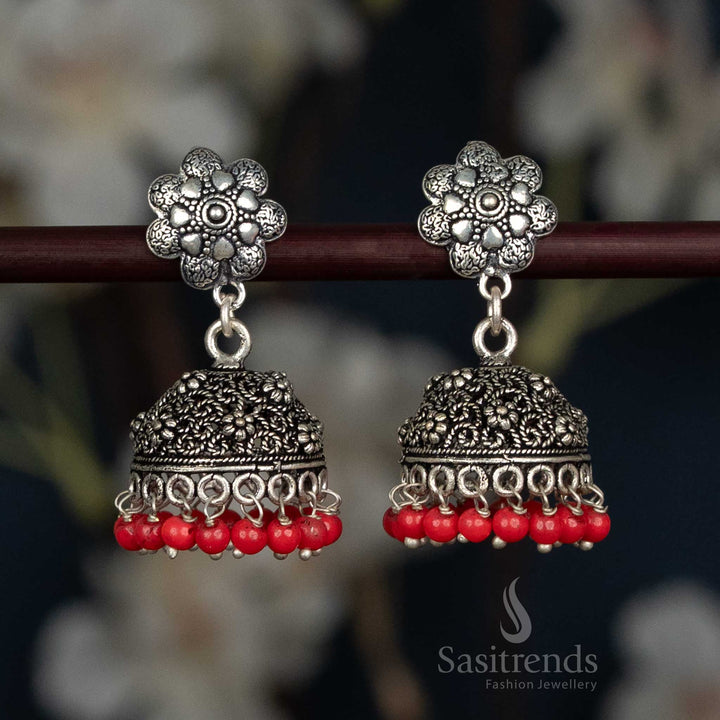 Grand Oxidised Floral Jhumka Earrings With Domed Carvings And Pearl Fringe In Bold Red Tone, A Classic Ethnic Jewellery Pair For Celebrations And Traditional Events – Sasitrends