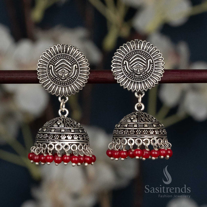 Tribal engraved oxidised jhumka earrings with sunburst top 