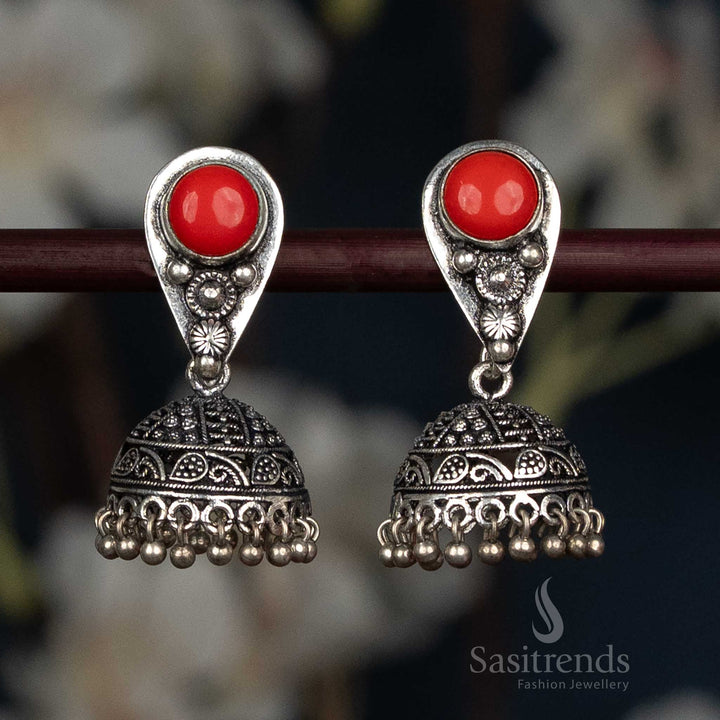 Elegant Oxidised Teardrop Stud Jhumka Earrings With Engraved Floral Dome In Red Colour, Handcrafted In German Silver For Festive And Bridal Styling – Sasitrends