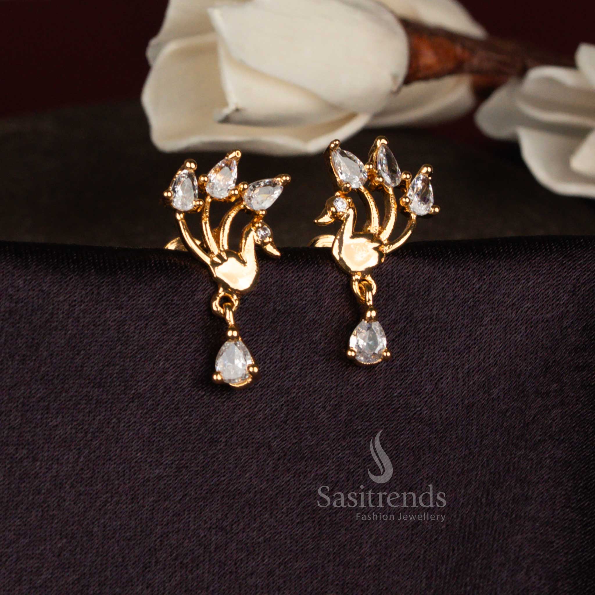 Pure peacock white American diamond micro gold plated stylized teardrop stud earrings ideal for festive functions, family celebrations, and stylish ethnic outings – Sasitrends