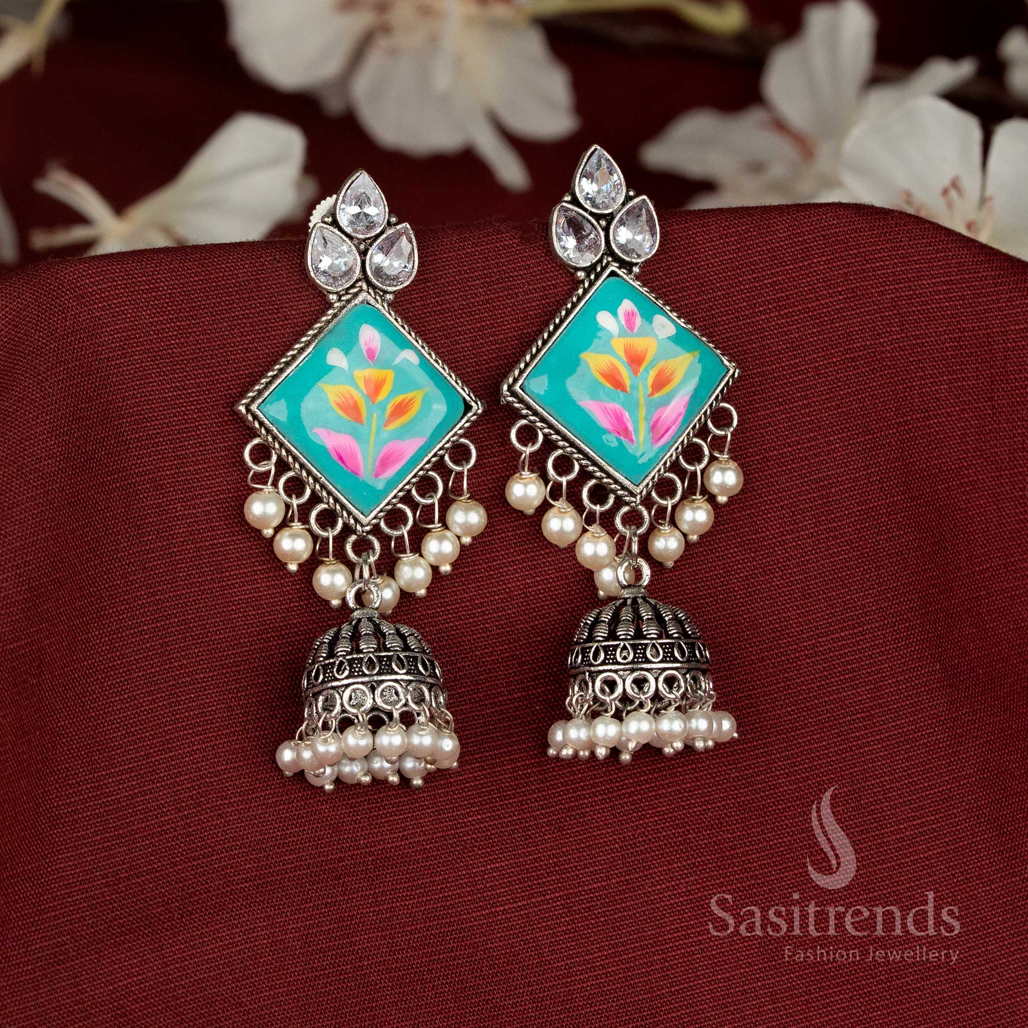 Oxidised sky-blue Monalisa jhumka earrings with diamond-cut accents offering graceful festive glow – Sasitrends