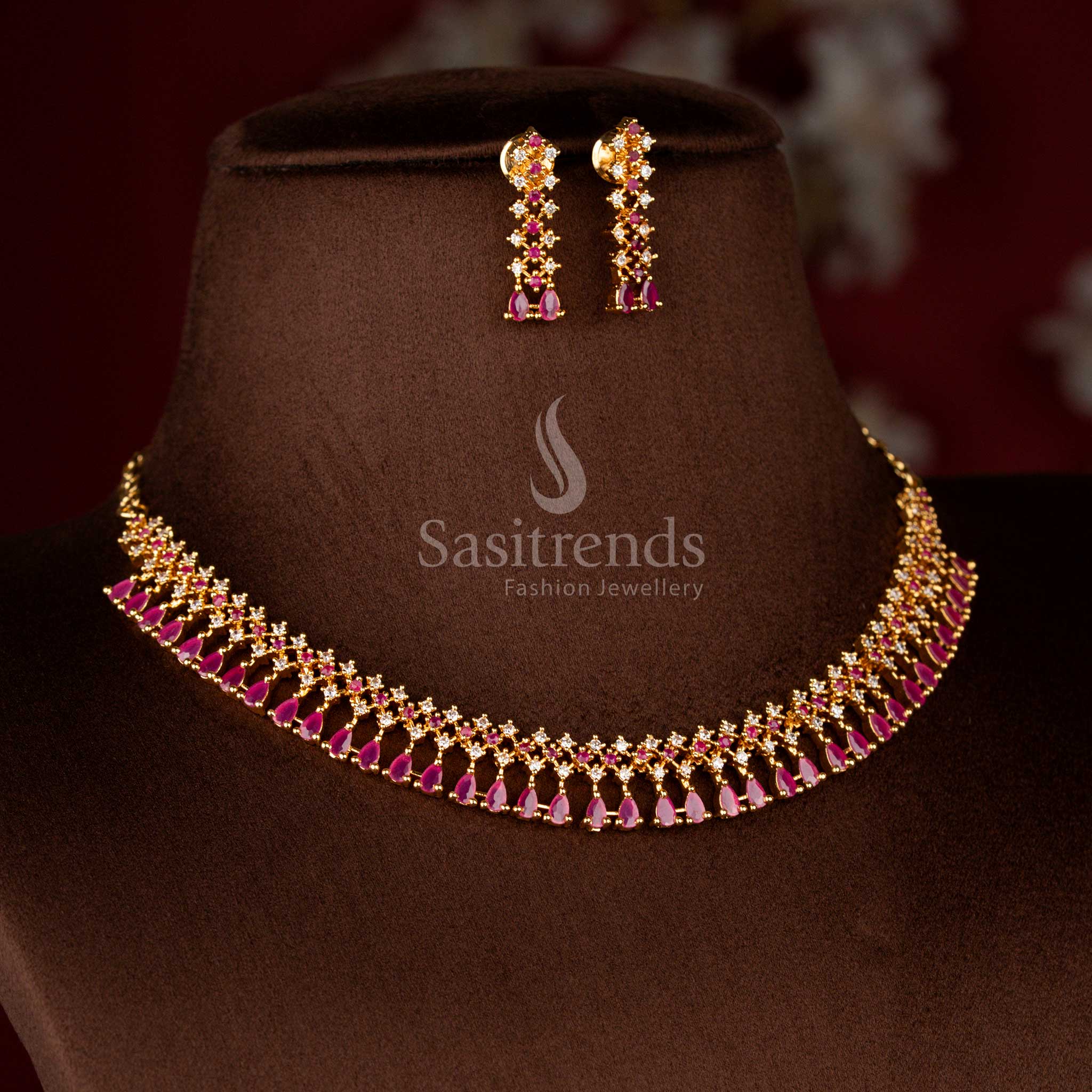 Charming micro gold plated AD floral necklace in white-ruby shades with round and pear cut stones – Sasitrends