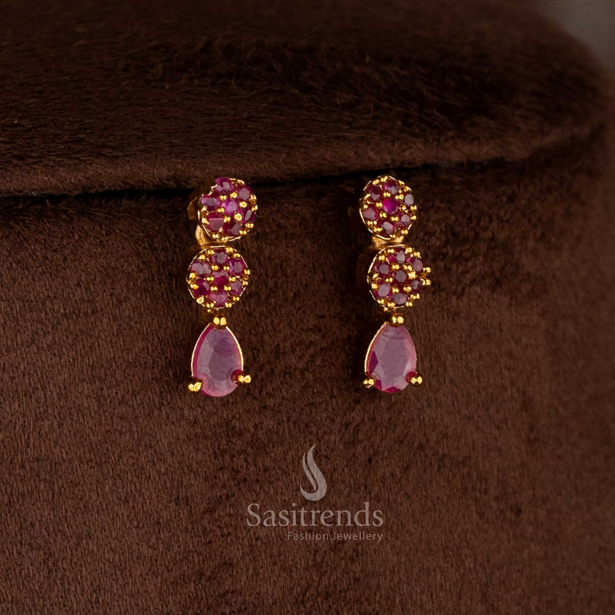 Charming American diamond matte gold plated ruby floral teardrop earrings for sarees, kurtis, and celebration-ready styling – Sasitrends