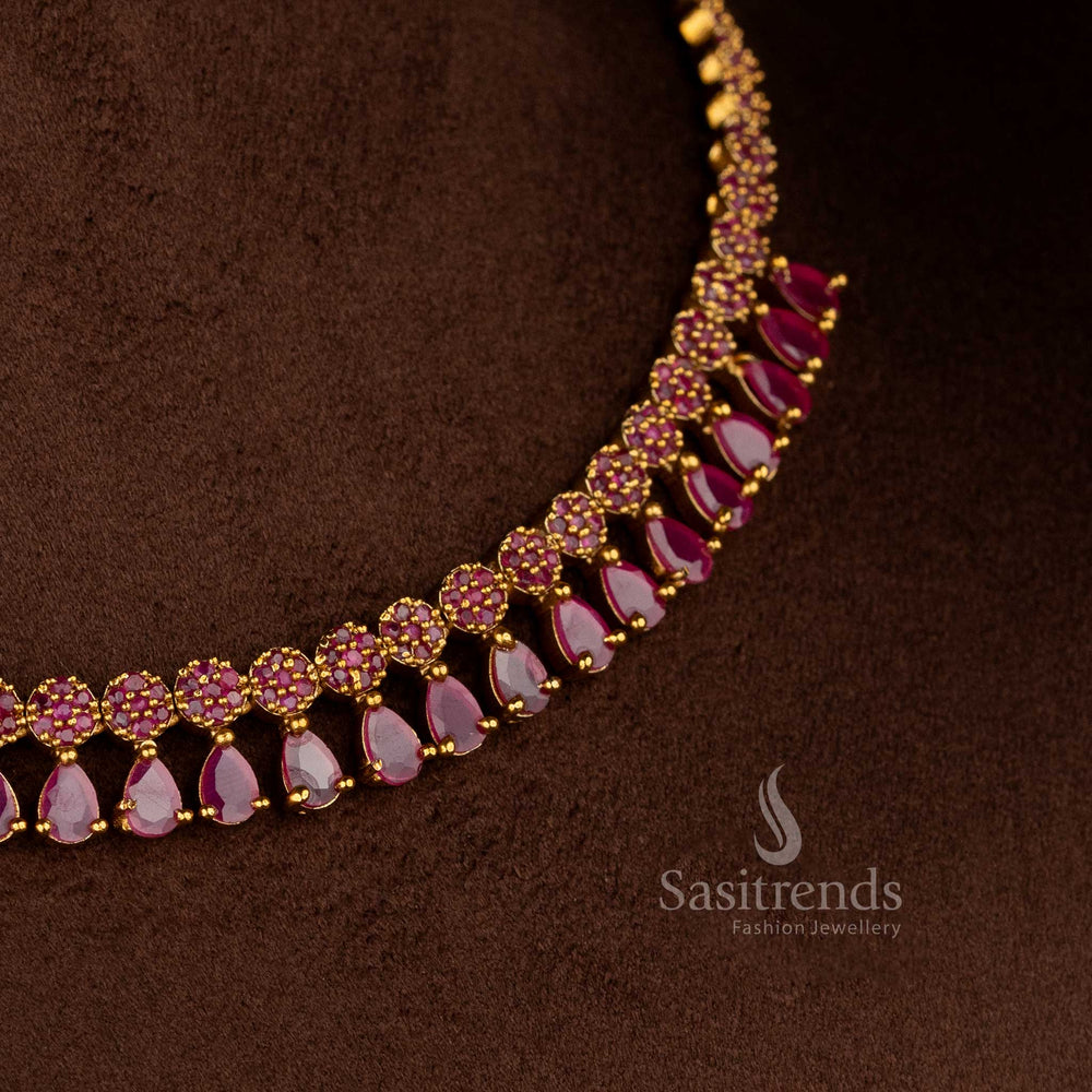 Stunning American diamond matte gold plated ruby floral teardrop necklace for silk sarees, festive kurtis, and celebration-ready looks – Sasitrends