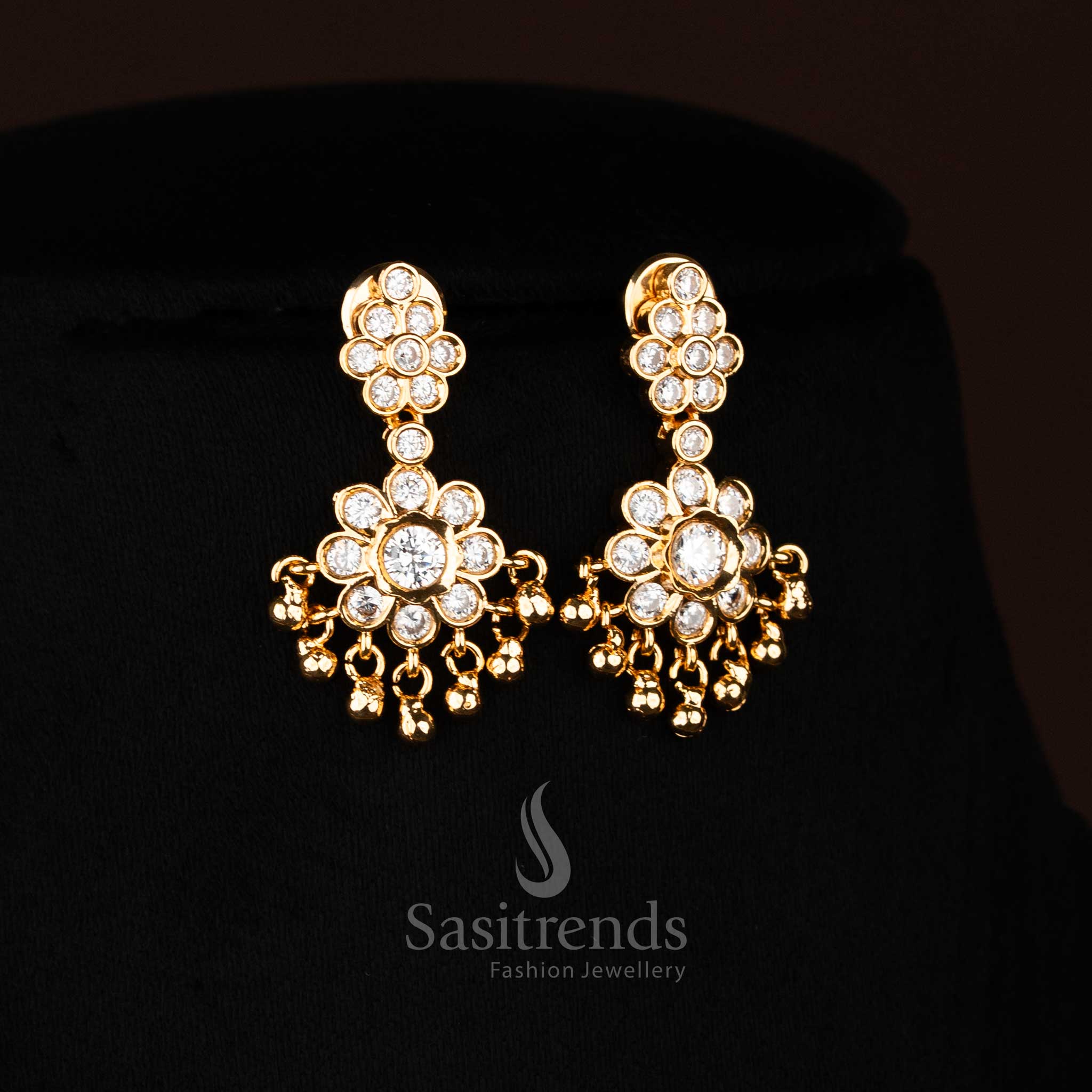 Radiant white American Diamond floral stud earrings with lustrous stones and golden beads ideal for bridal elegance and festive Jewellery - Sasitrends