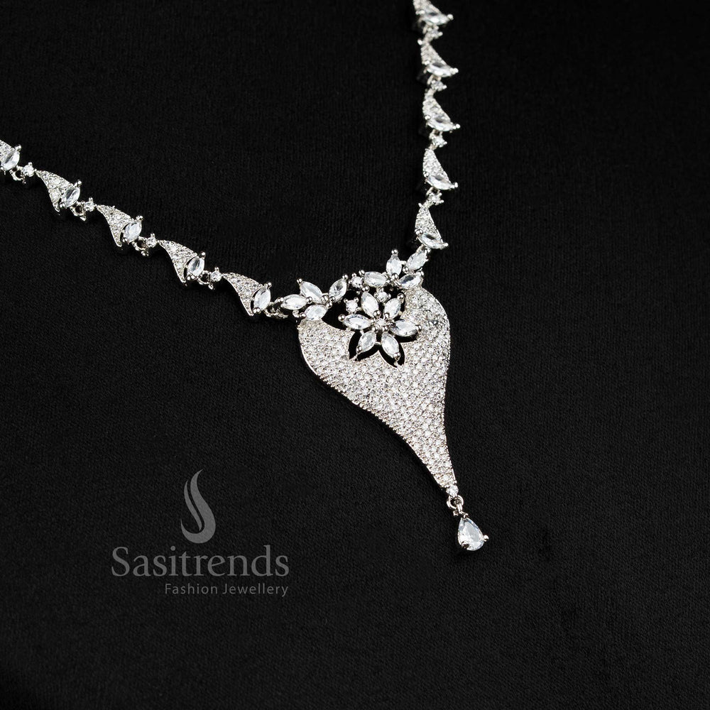 Elegant American diamond necklace set in rhodium silver finish featuring a graceful floral pendant, ideal for festive and party wear – Sasitrends