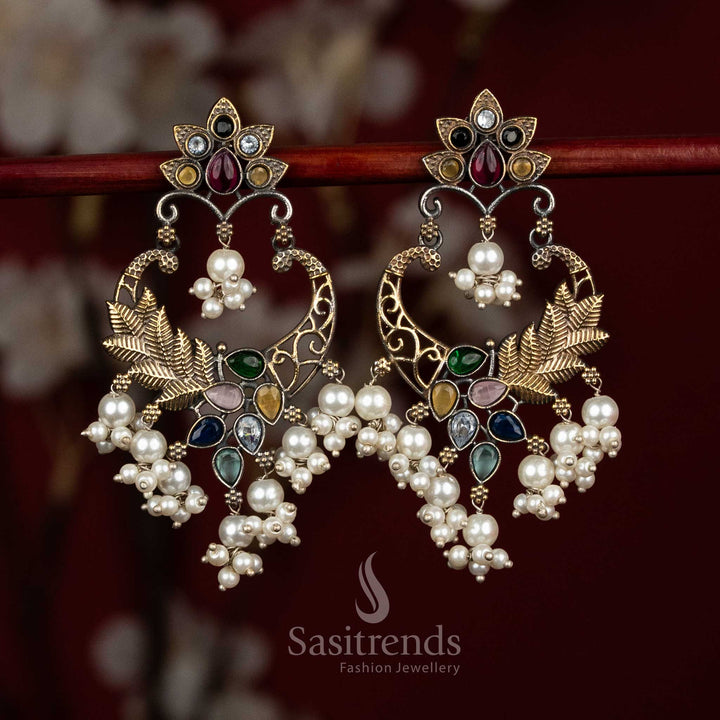 Artistic oxidised 92.5 silver earrings crafted with multi colour Monalisa stones, detailed mandala chandbali form, peacock arch ornamentation and pearl bunch hangings for statement ethnic wear - Sasitrends