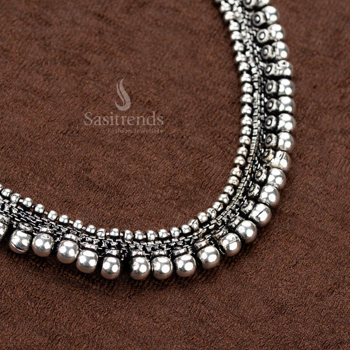 Exquisite traditional oxidised silver necklace set featuring artistic dual ball rows and floral motif earrings, a perfect accessory for festive wear, temple visits, and ethnic charm - Sasitrends