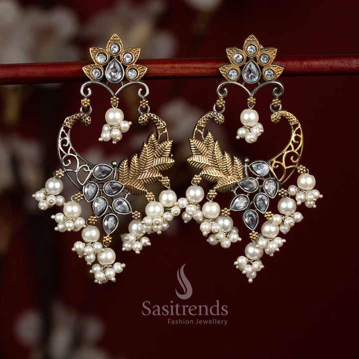 Refined oxidised silver earrings featuring white Monalisa stones, sculpted mandala chandbali design, peacock arch filigree and delicate pearl bunch hangings for sophisticated ethnic looks - Sasitrends