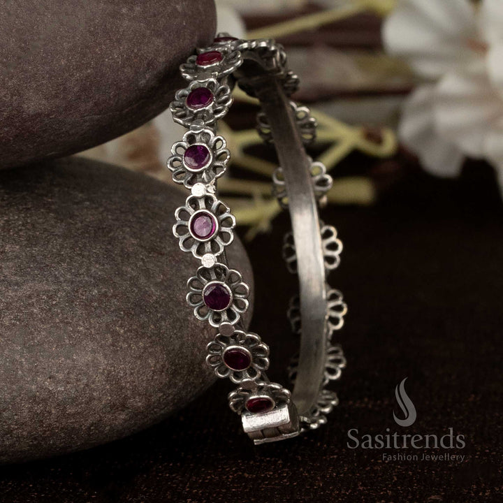 Stunning oxidised party wear kada bracelet with deep ruby stone accents and floral carvings, best for festive parties and grand styling – Sasitrends