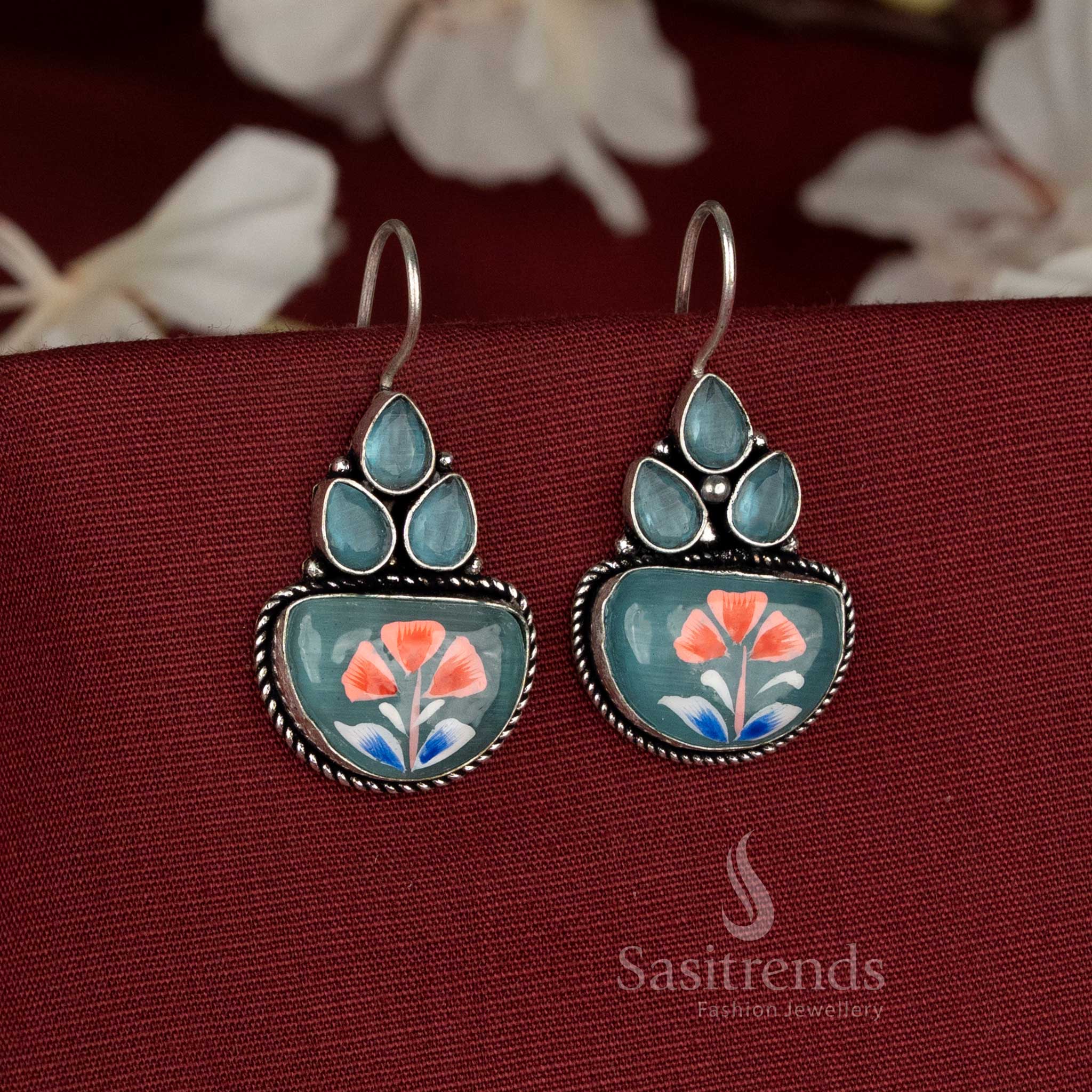 Seamist hand-painted oxidised earrings detailed with aqua blue Monalisa stones and graceful bloom contours – Sasitrends