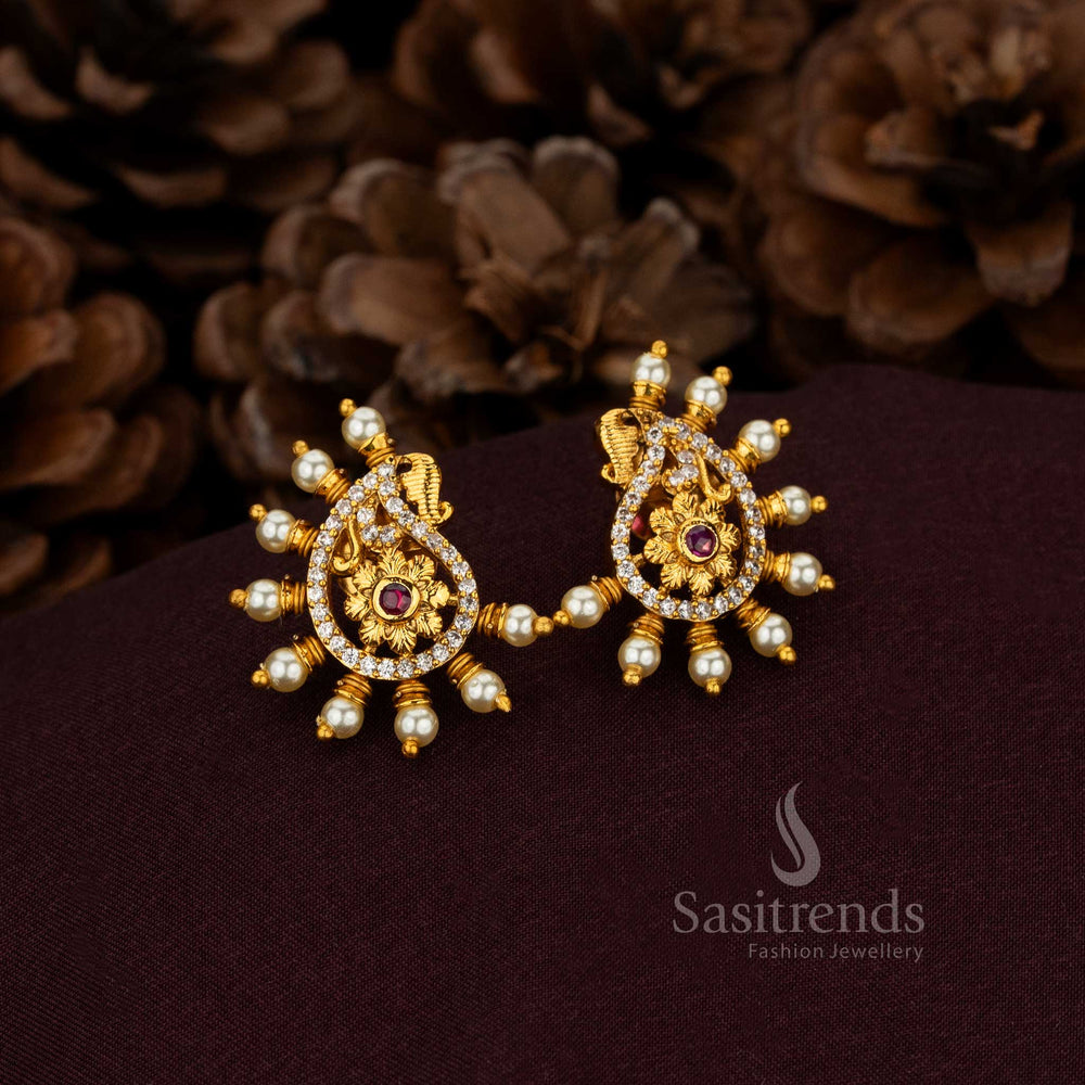 Sovereign Ruby Paisley Pearl Drop Earrings Designed With Illustrious Gold Finish And Splendid Floral Carvings – Magnificent Heritage Jewellery For Divine Brides And Timeless Traditions – Sasitrends