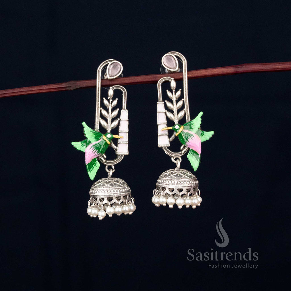 Graceful flight oxidised hummingbird earrings with leaf dangler and pearl embellishments hand-painted for Navaratri fashion – Sasitrends
