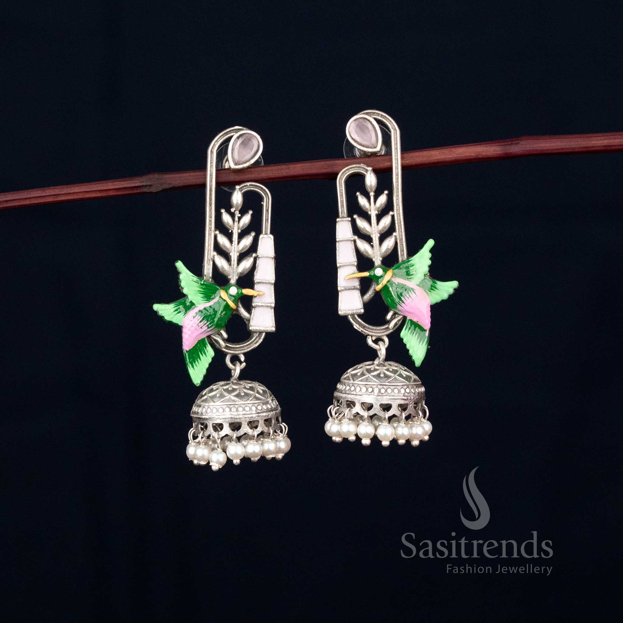 Graceful flight oxidised hummingbird earrings with leaf dangler and pearl embellishments hand-painted for Navaratri fashion – Sasitrends