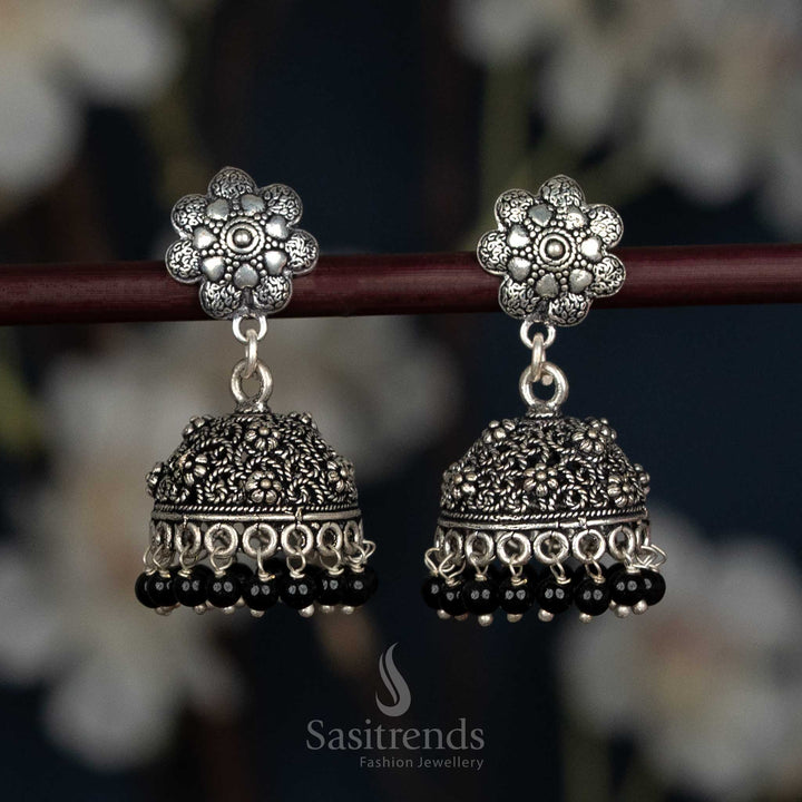 Bold Oxidised Floral Jhumka Earrings With Leaf Motif Studs And Textured Dome In Black Tone, Designed For Women Seeking Stylish Traditional Jewellery – Sasitrends