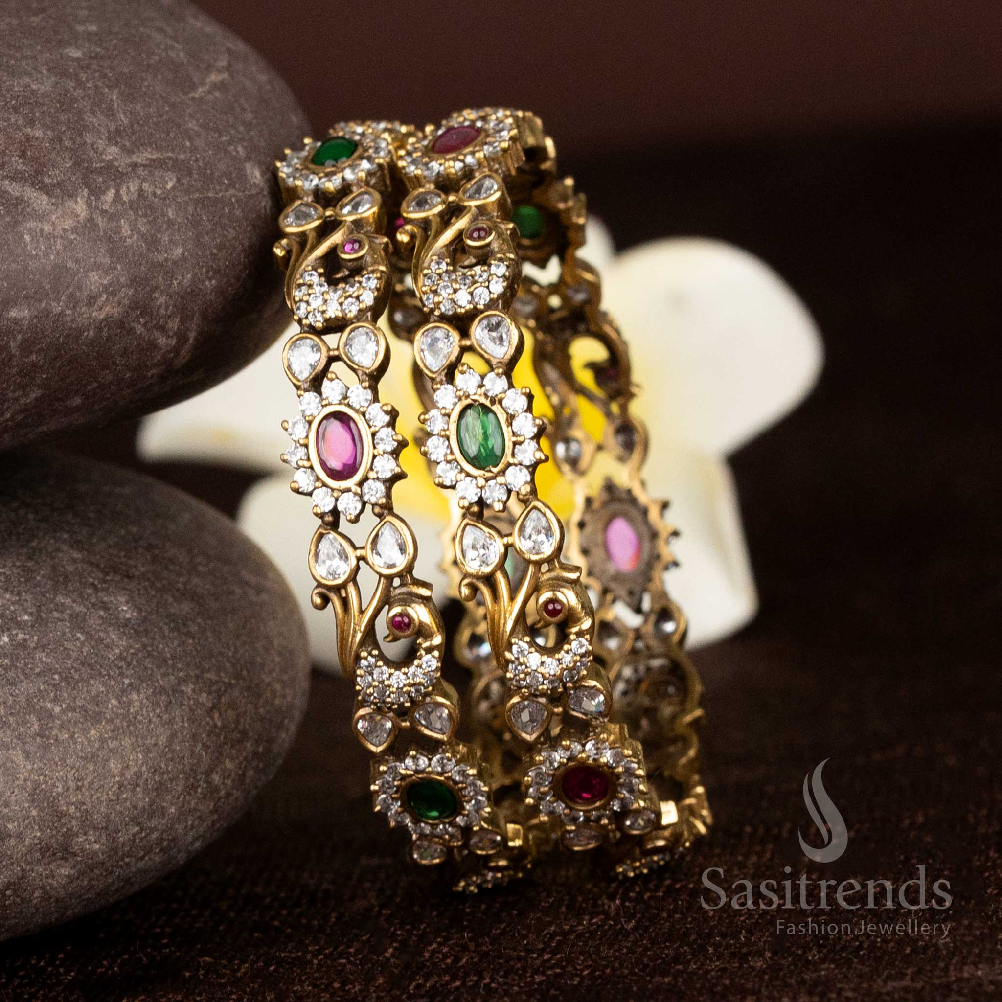 Regal Victorian plated bangles with peacock motifs, American diamonds, and multi colour oval stones exuding festive brilliance - Sasitrends
