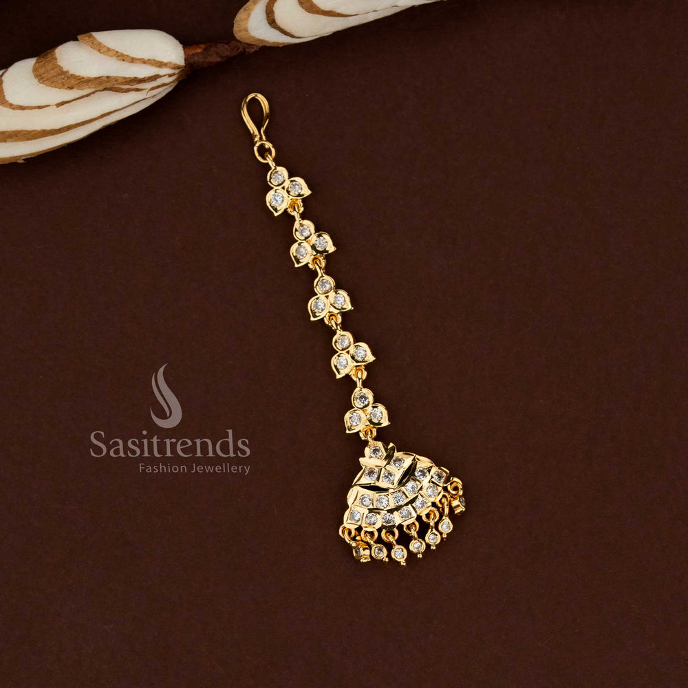 Artistic white tone tribal inspired Impon micro gold plated American diamond maang tikka suitable for bridal styling festive gatherings and ethnic fashion wear - Sasitrends